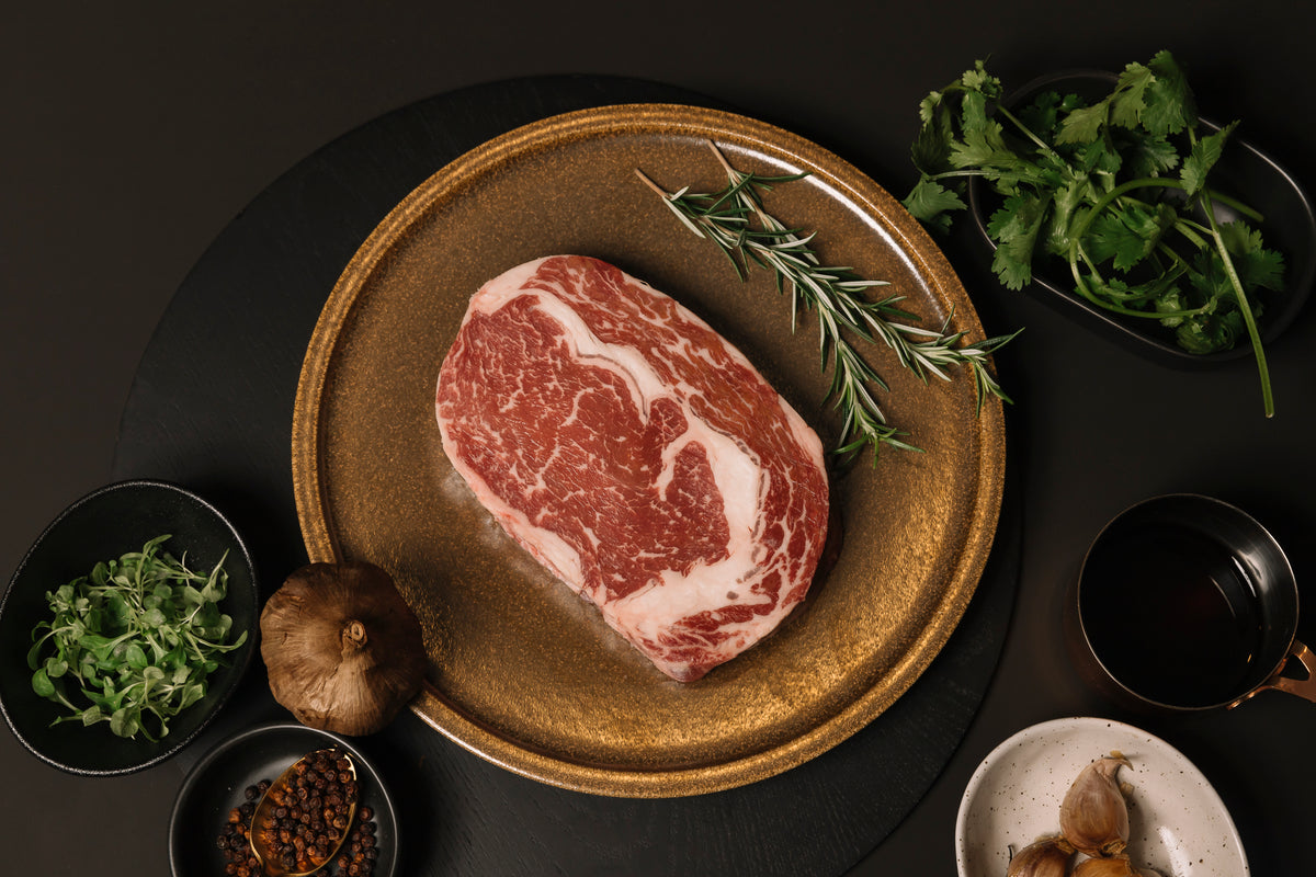 Herd & Grace premium raw Pure Black Angus ribeye steak